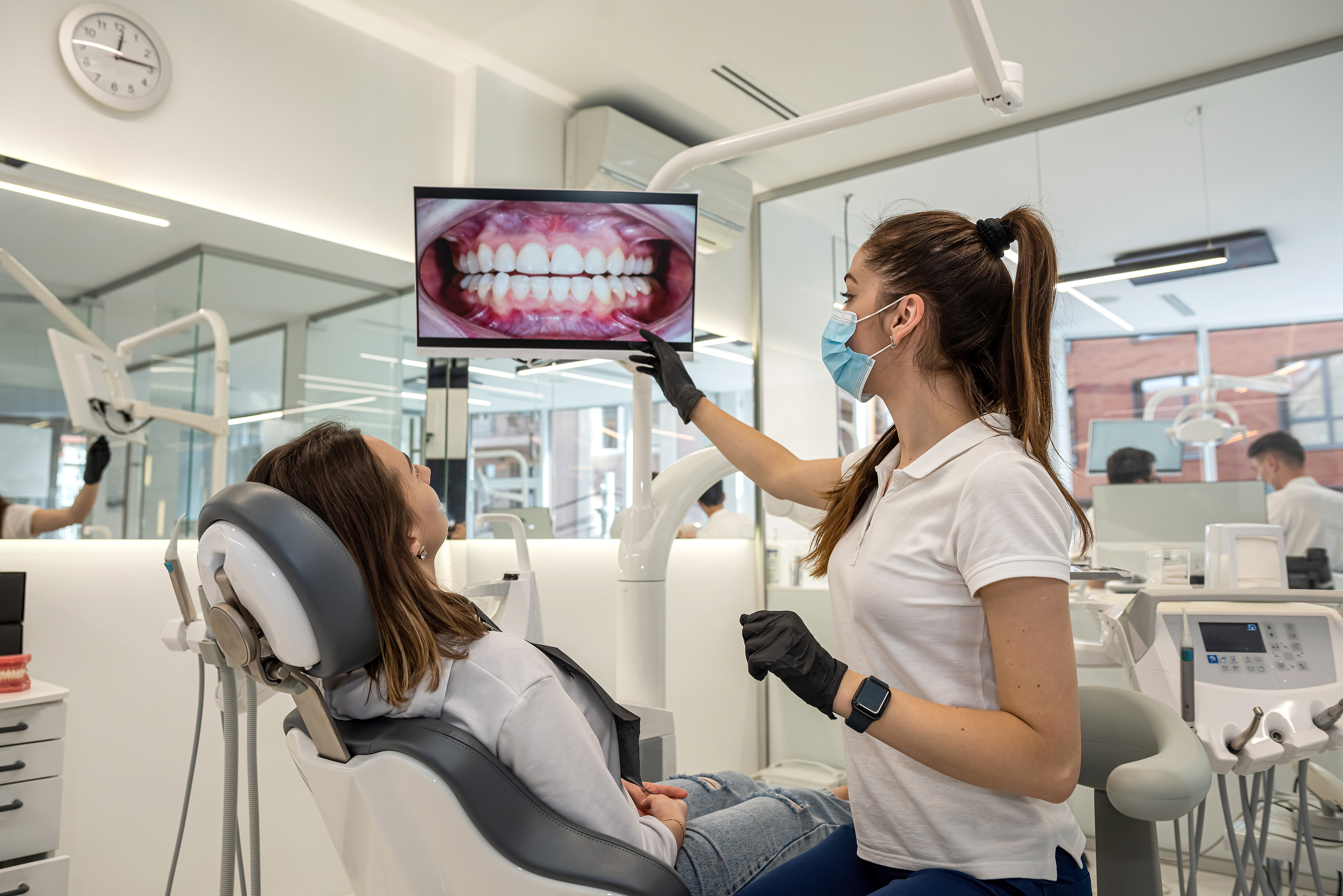 Dentist examining a patient's cracked tooth in Las Vegas